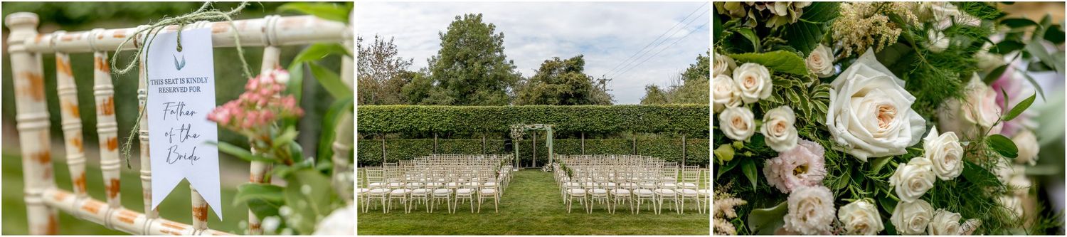 Elegant floral arrangements and white chairs set up for an outdoor garden wedding ceremony.