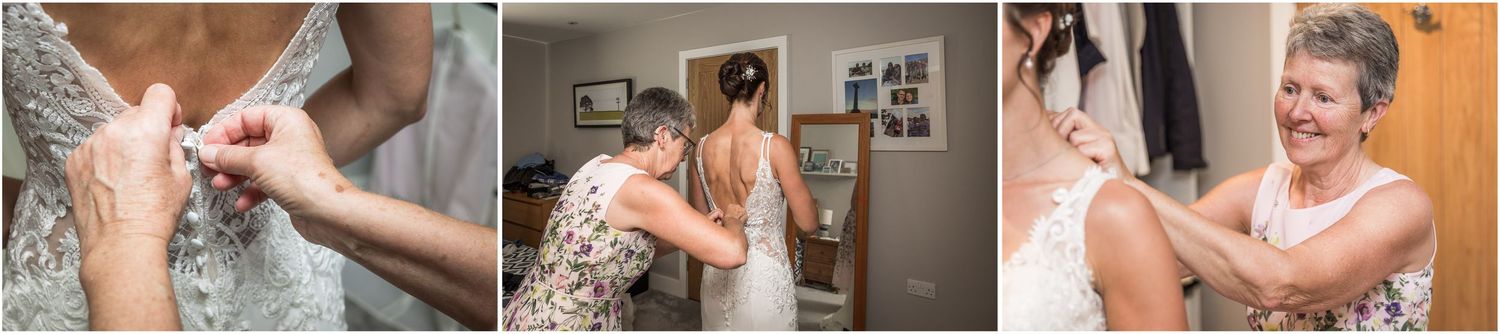 Candid photography of the bride getting into her wedding dress