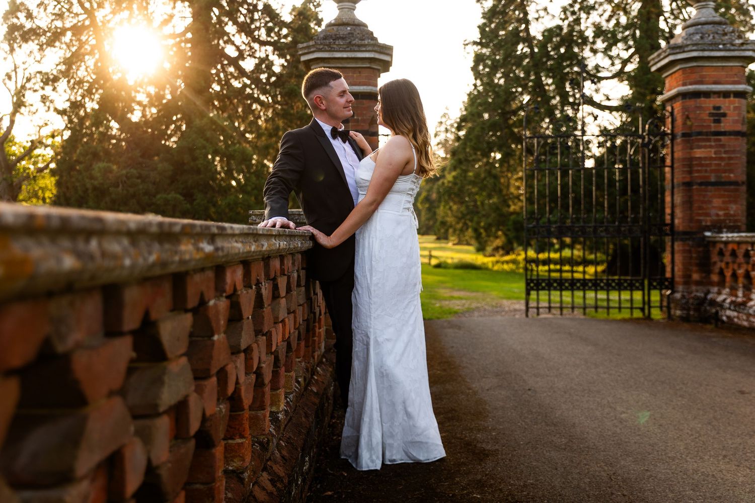 Bride and groom wedding portrait in the evening sunlight at The Elvetham Hotel in Hampshire