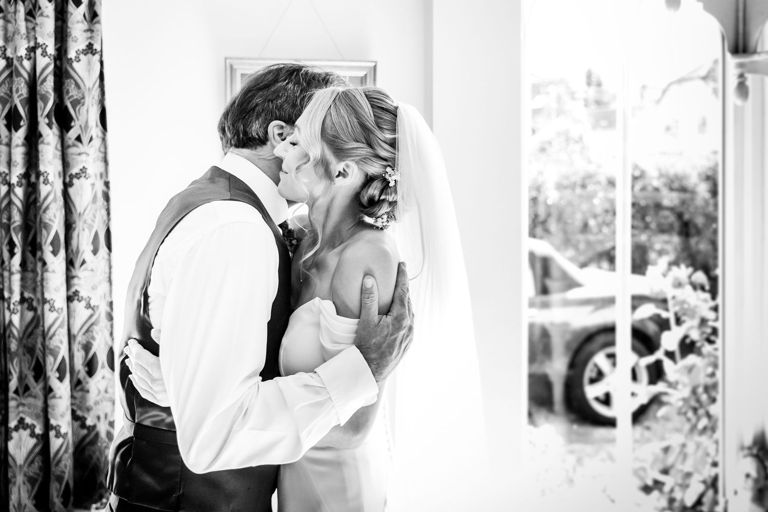 Wedding day candid moments captured in black and white photography.