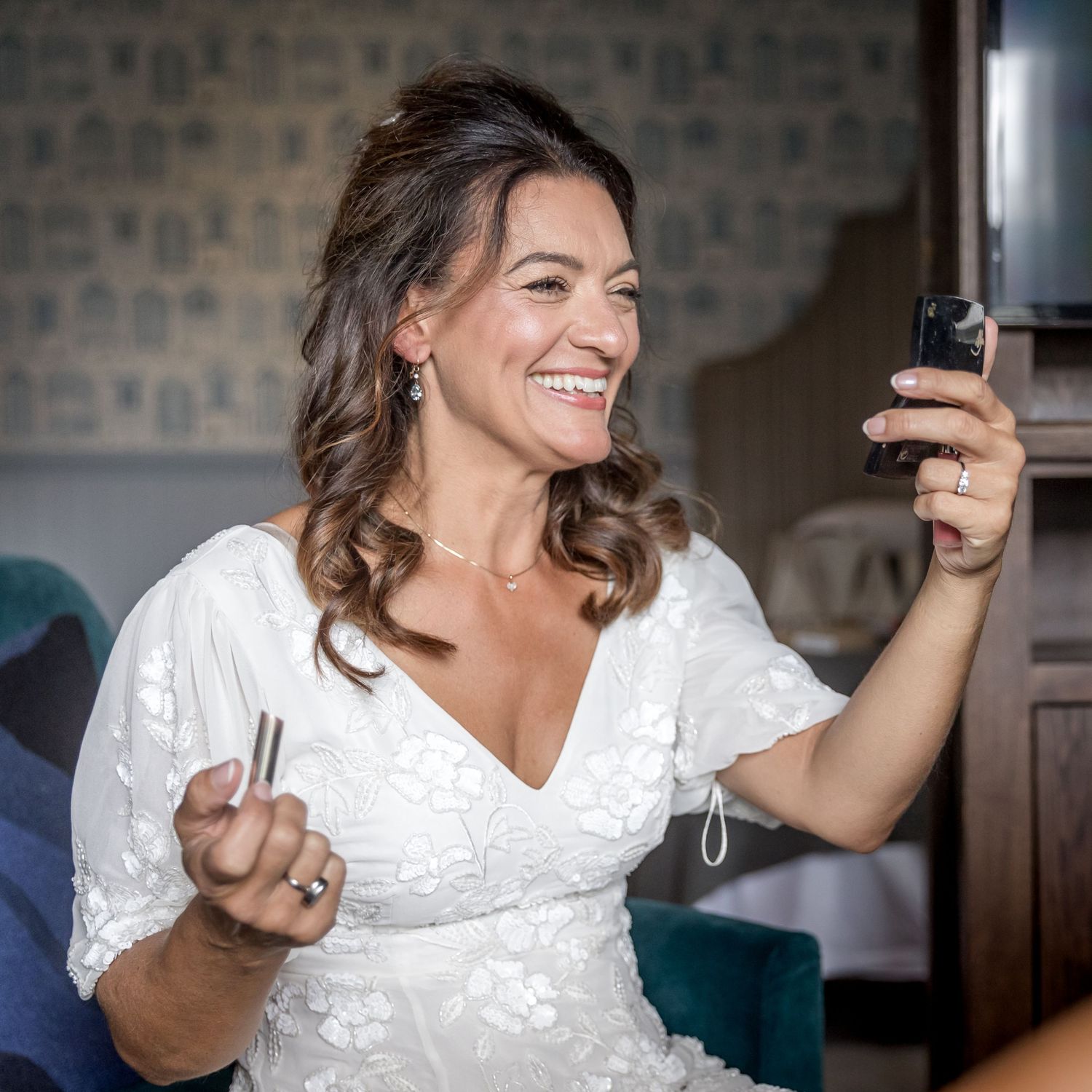 Candid moments of laughter and joy during wedding preparation.