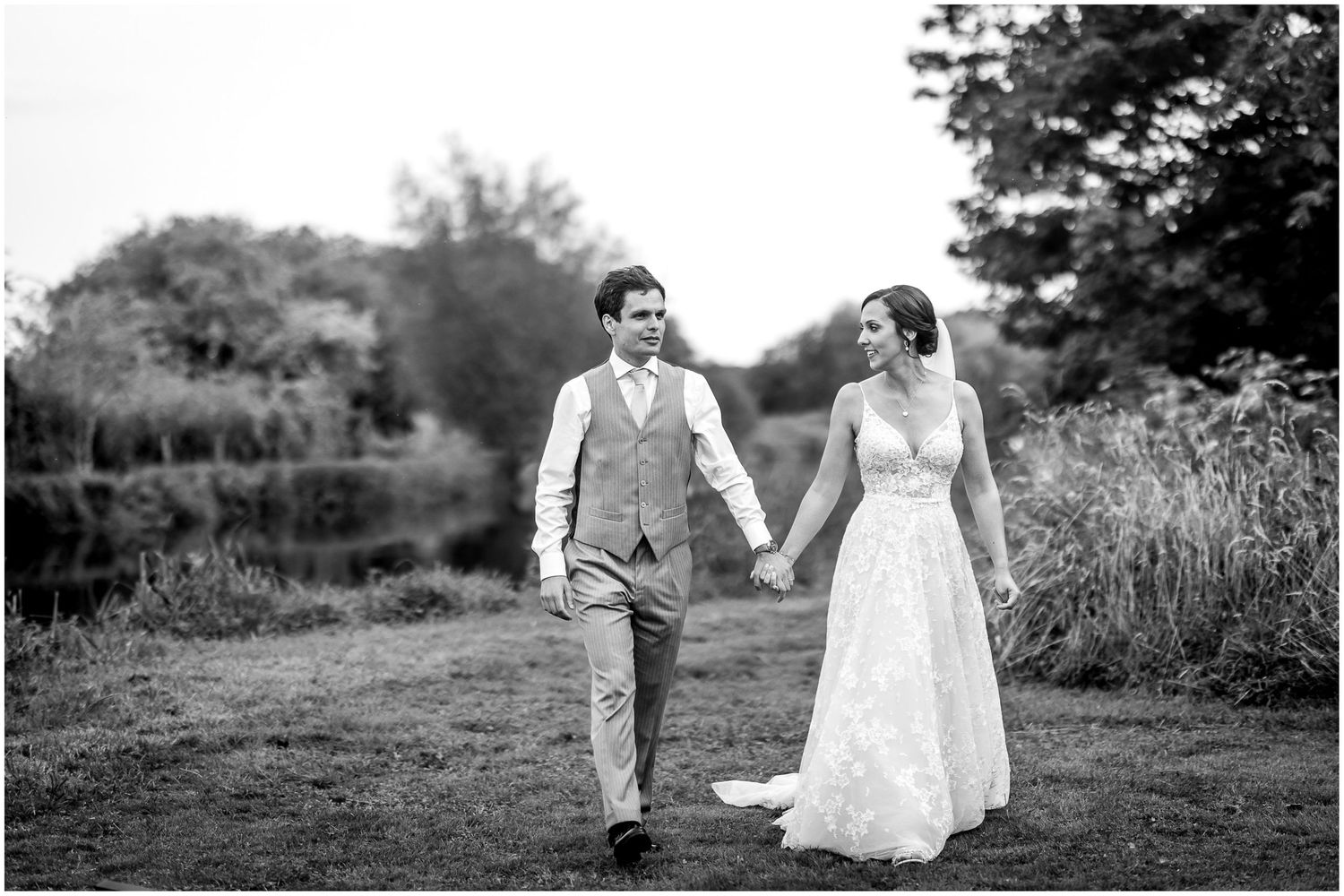 Black and white wedding portraits captured in a rustic outdoor setting.