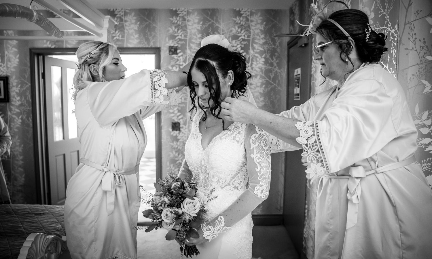 Wedding preparation moments captured in vintage-style black and white photography.