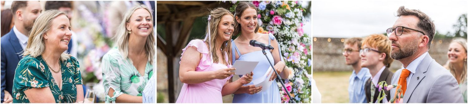 Guests watch as the bride's sisters give a speech on her wedding day.