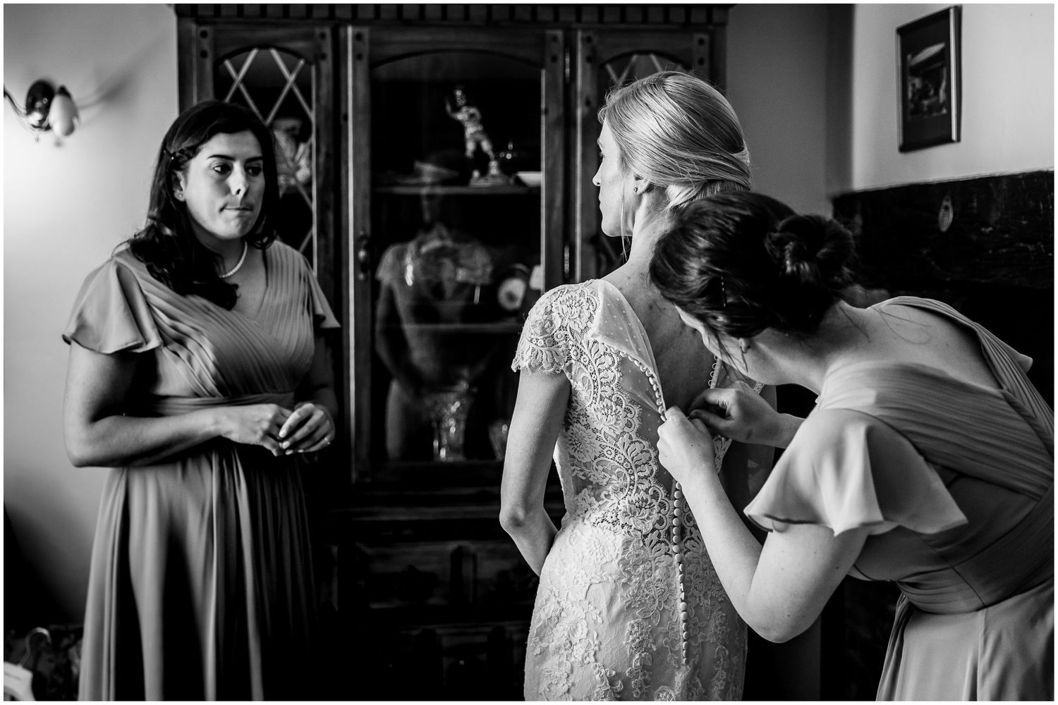 Intimate black and white photographs capturing pre-wedding moments indoors.