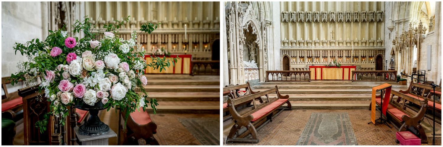 Elegant floral arrangements adorning a traditional church interior with wooden pews.