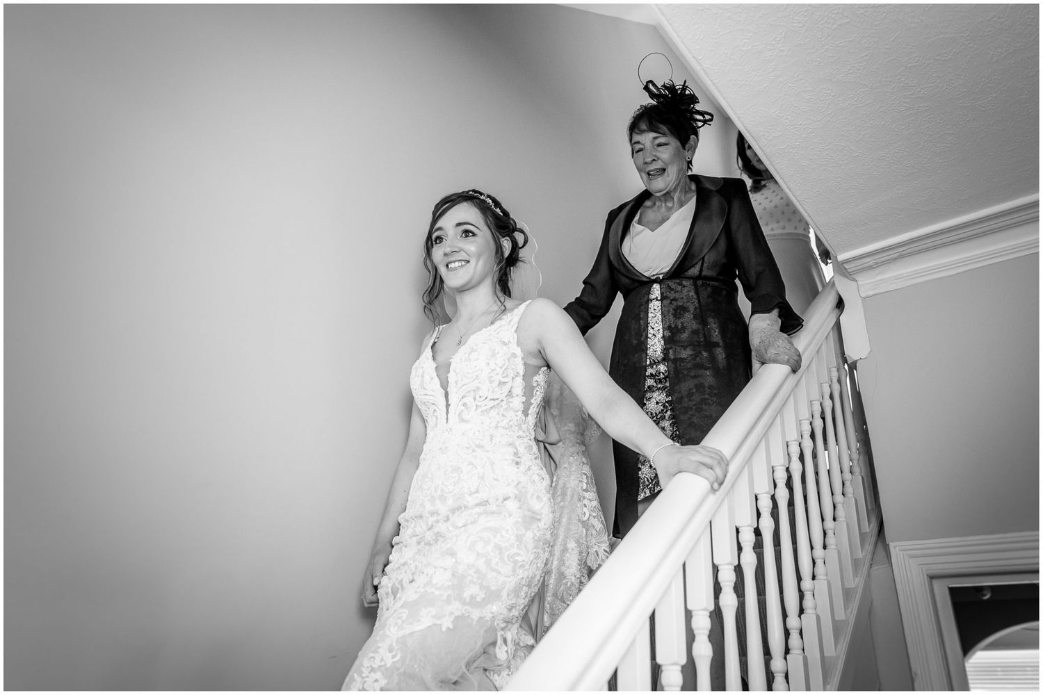 Monochrome images showing wedding day preparations on an elegant staircase.