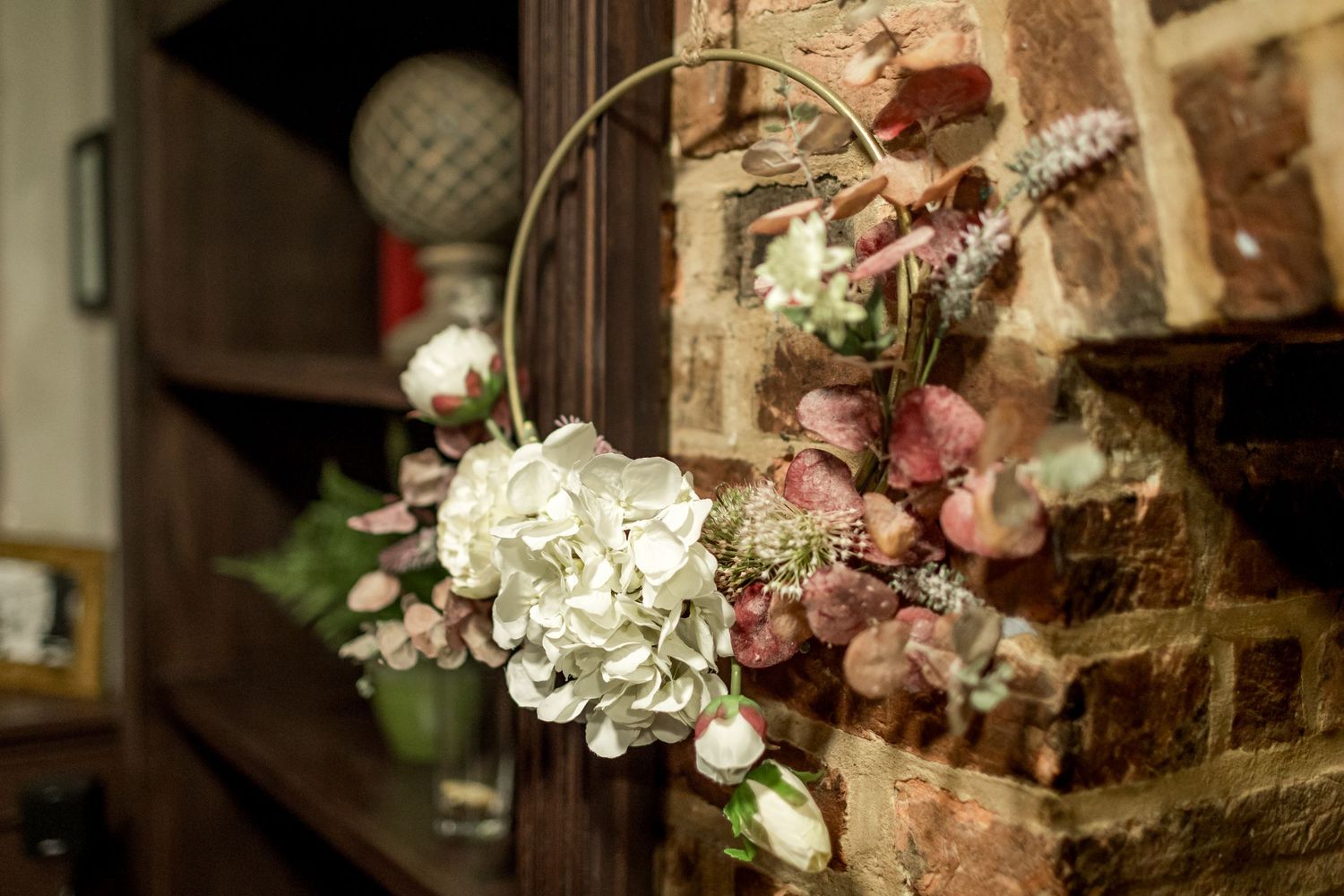 Delicate floral arrangements with pink and white blooms decorate the wedding venue.