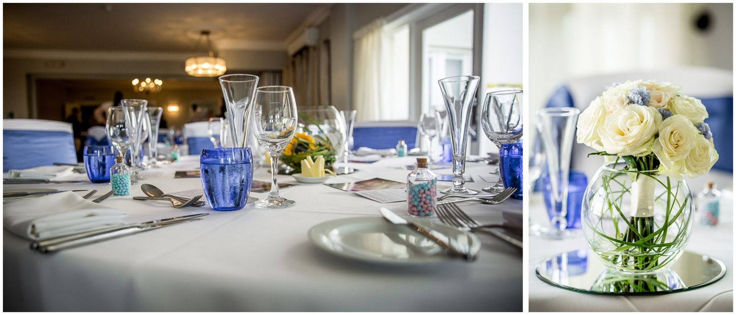 Elegant table settings with blue glassware and white linens in an upscale restaurant dining room.