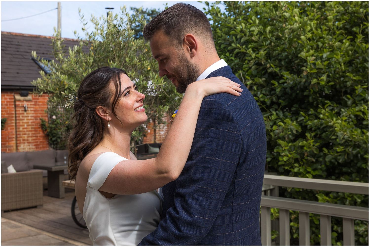 The bride and groom looking at each other for a wedding portrait photograph