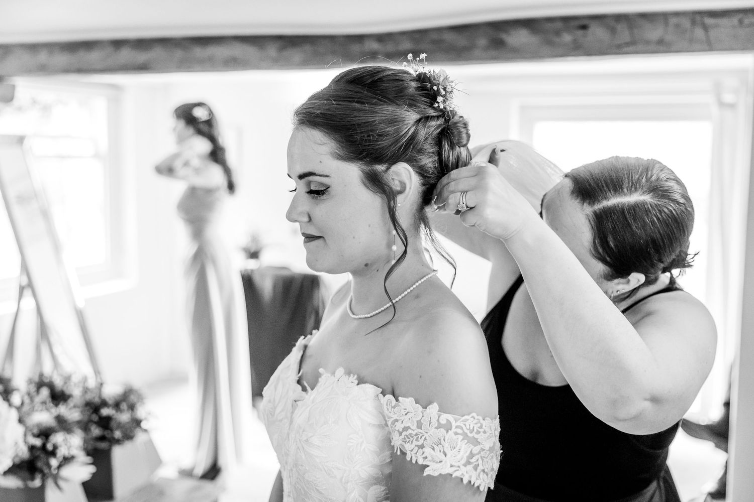 A series of intimate getting ready moments captured in black and white photography.