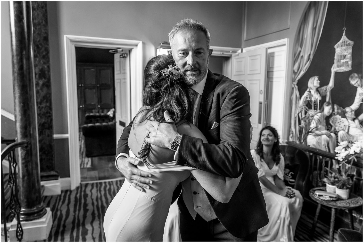 Black and white candid shots of wedding guests enjoying a meal at reception tables.