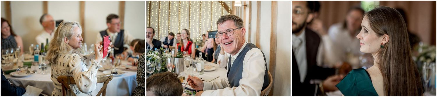 Wedding guests mingling and celebrating during an indoor reception event.