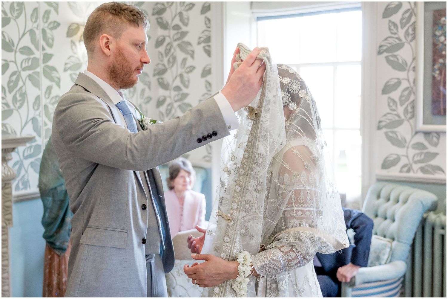 Wedding photography sequence showing interactions by a window with floral patterned curtains.