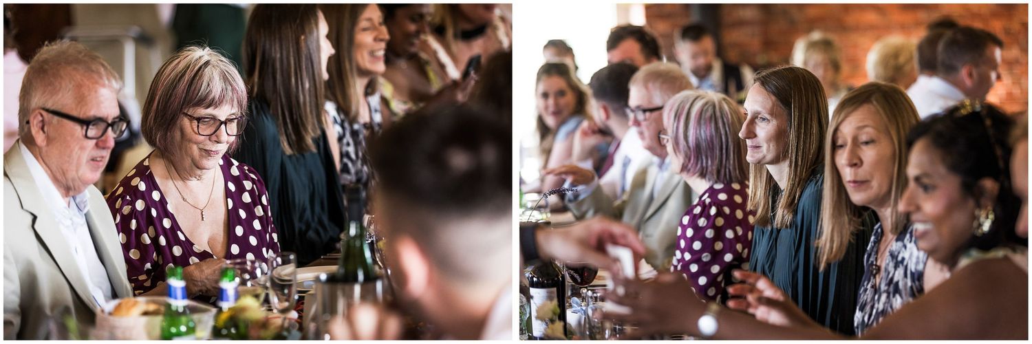 Guests socializing and laughing during the wedding breakfast, seated at banquet style tables at Sopley Mill