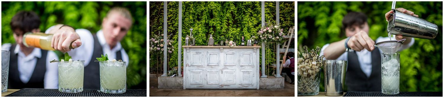 Wedding party celebrates with champagne toasts in lush garden setting.