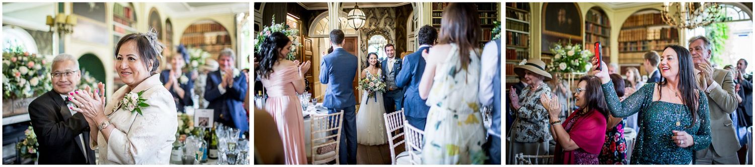 Wedding celebration with guests mingling in an ornate historic venue.