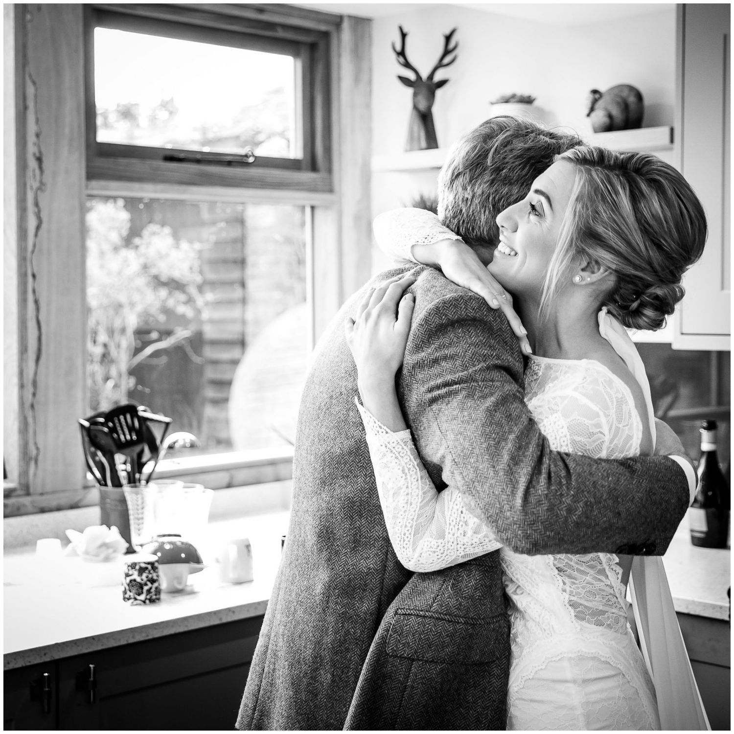 Black and white photo series showing intimate emotional moments between people at a wedding celebration.