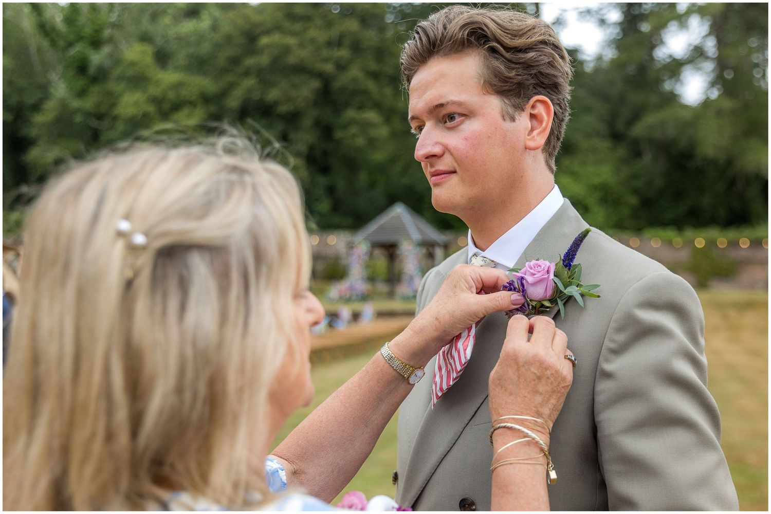 Finishing touches for the groom before the ceremony begins.