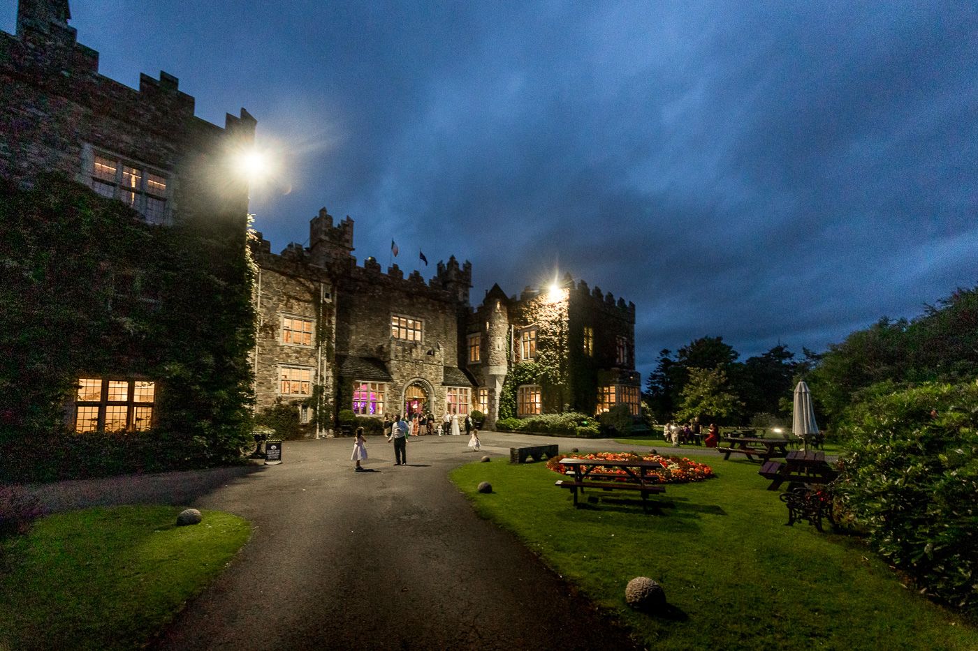 Nighttime exterior views of a historic building with atmospheric lighting and stone walls.