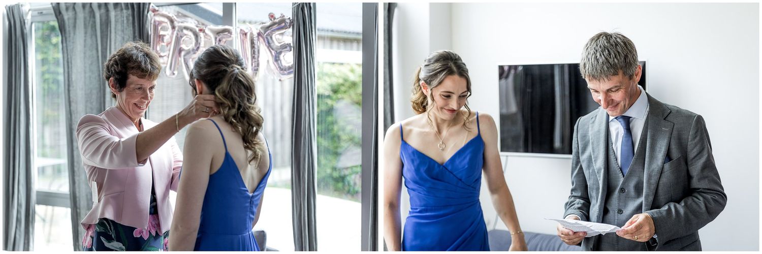 Elegant wedding party poses in formal attire with bridesmaids in blue dresses and groomsmen in dark suits.