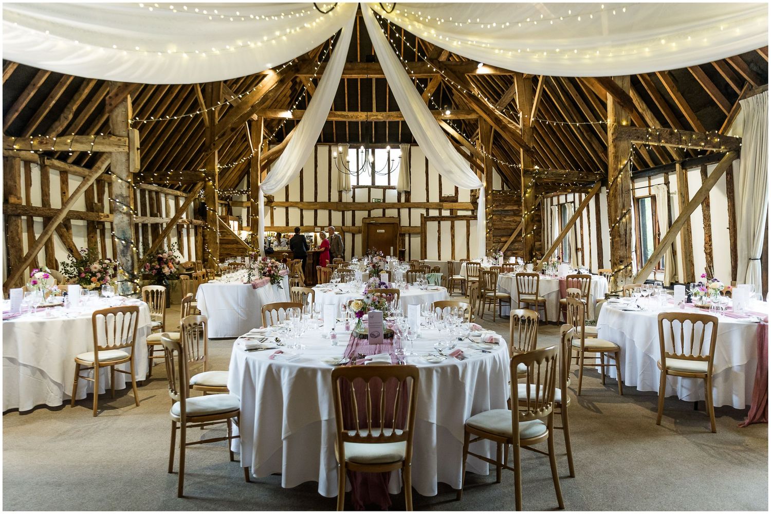 Clock barn wedding venue interior set up for the wedding breakfast