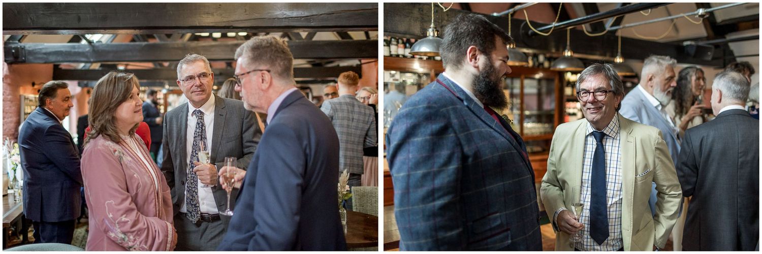 Group of people mingling and socializing at a wedding reception in Winchester.