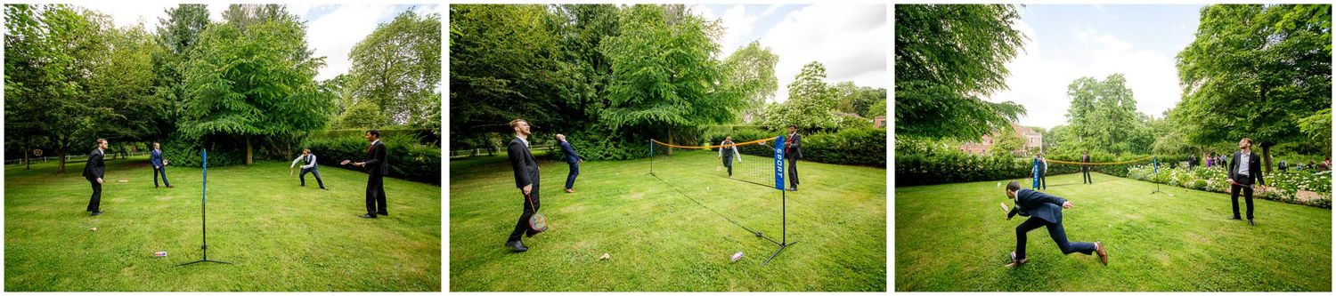 People enjoying outdoor activities in a lush green park setting with scattered trees on a sunny day.