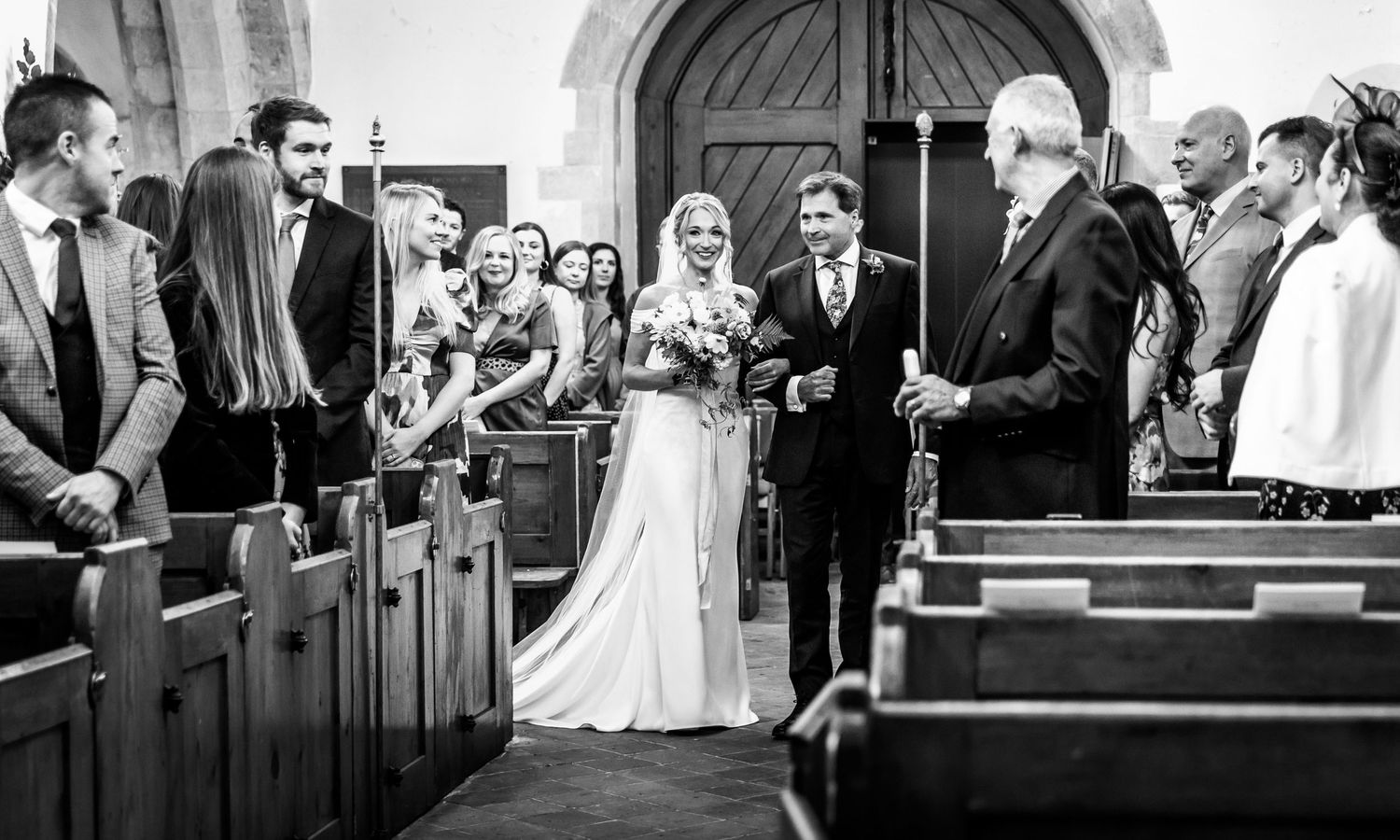 Black and white photos capturing traditional church wedding ceremony moments.