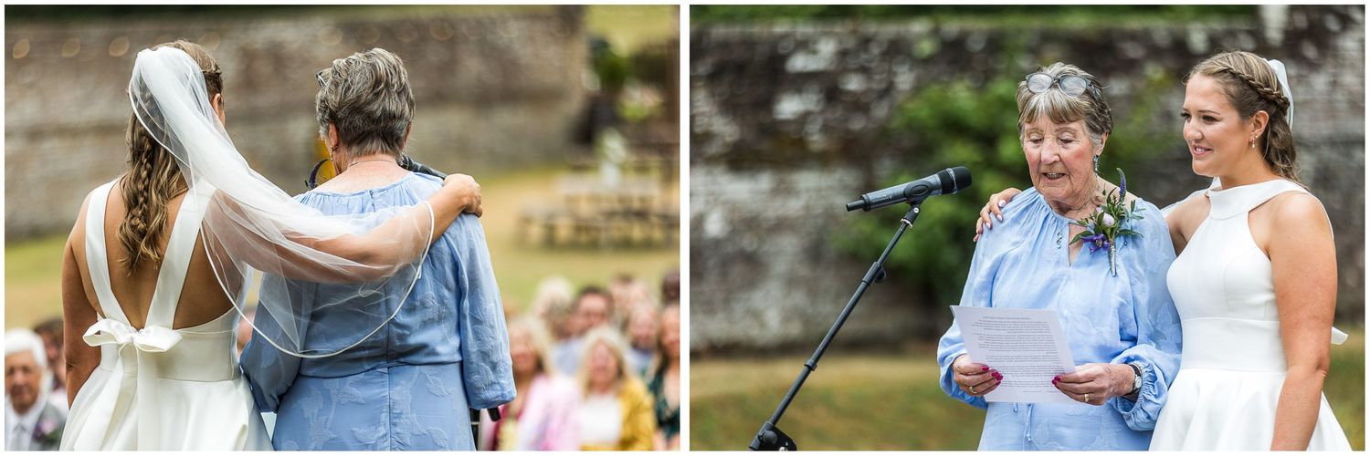 The bride stands with a relative as she gives a reading at the start of the wedding service