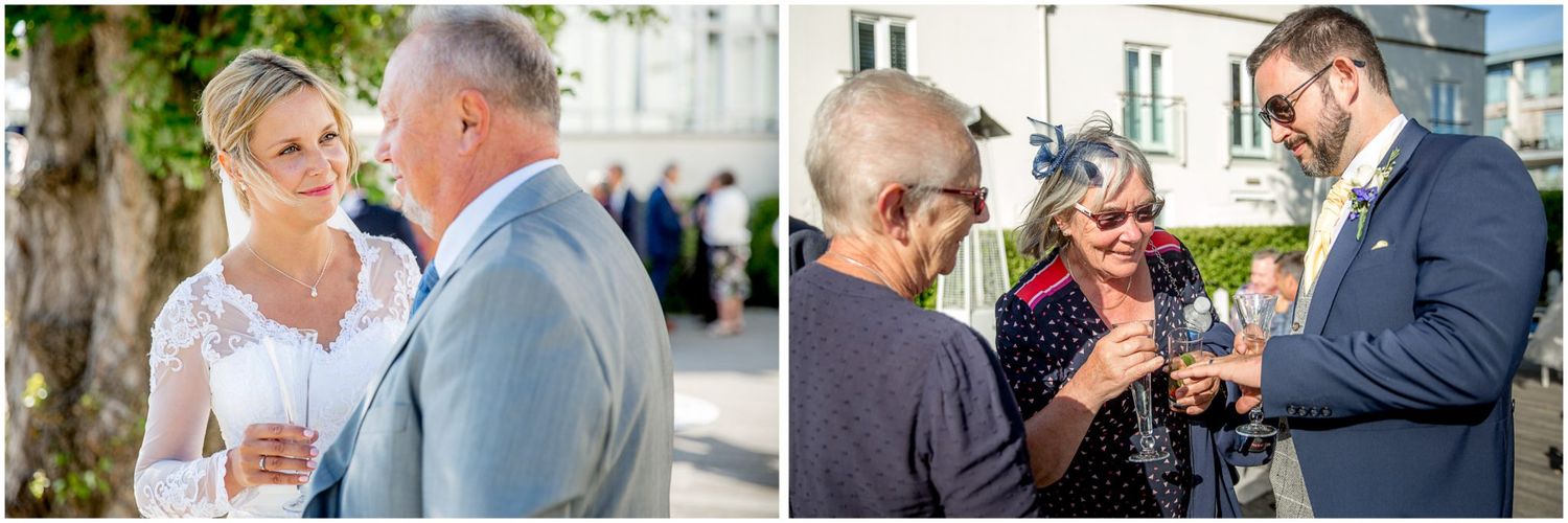 Guests enjoying drinks and conversation at an outdoor social gathering during a sunny afternoon.