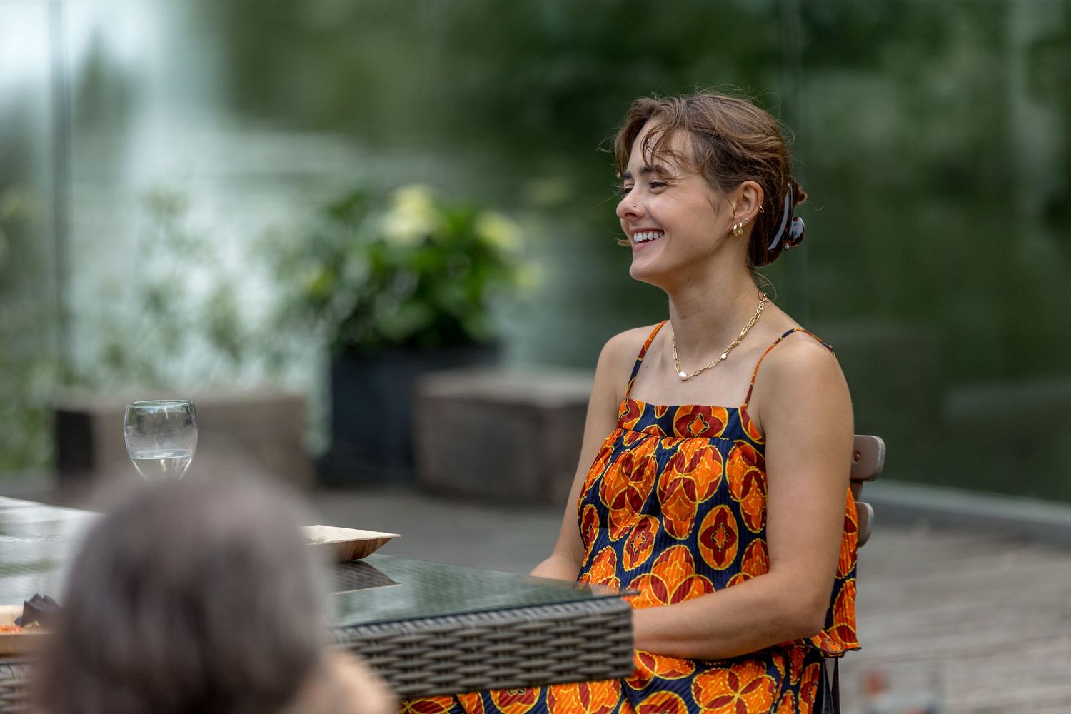 Guests enjoying conversation at an outdoor summer party.