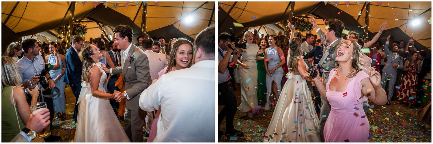 Guests dancing and celebrating with confetti at a lively outdoor wedding reception under a marquee tent at night.