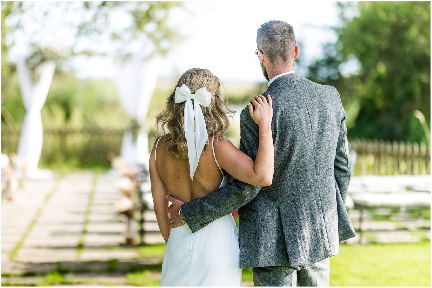 Elegant wedding portraits taken against natural greenery and garden backgrounds.
