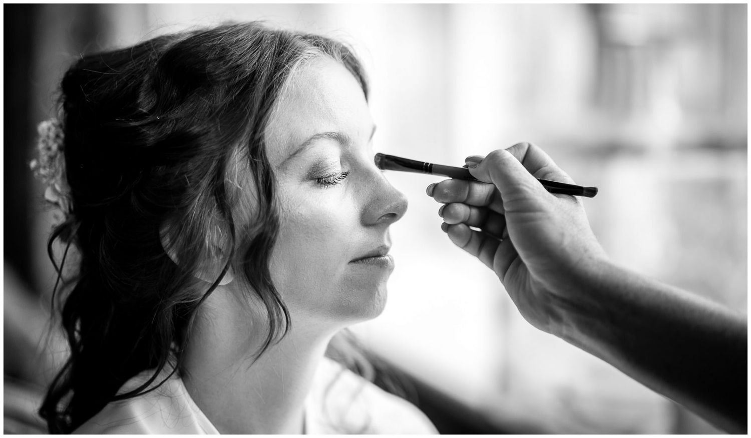 Black and white photos showing makeup application and styling preparations.