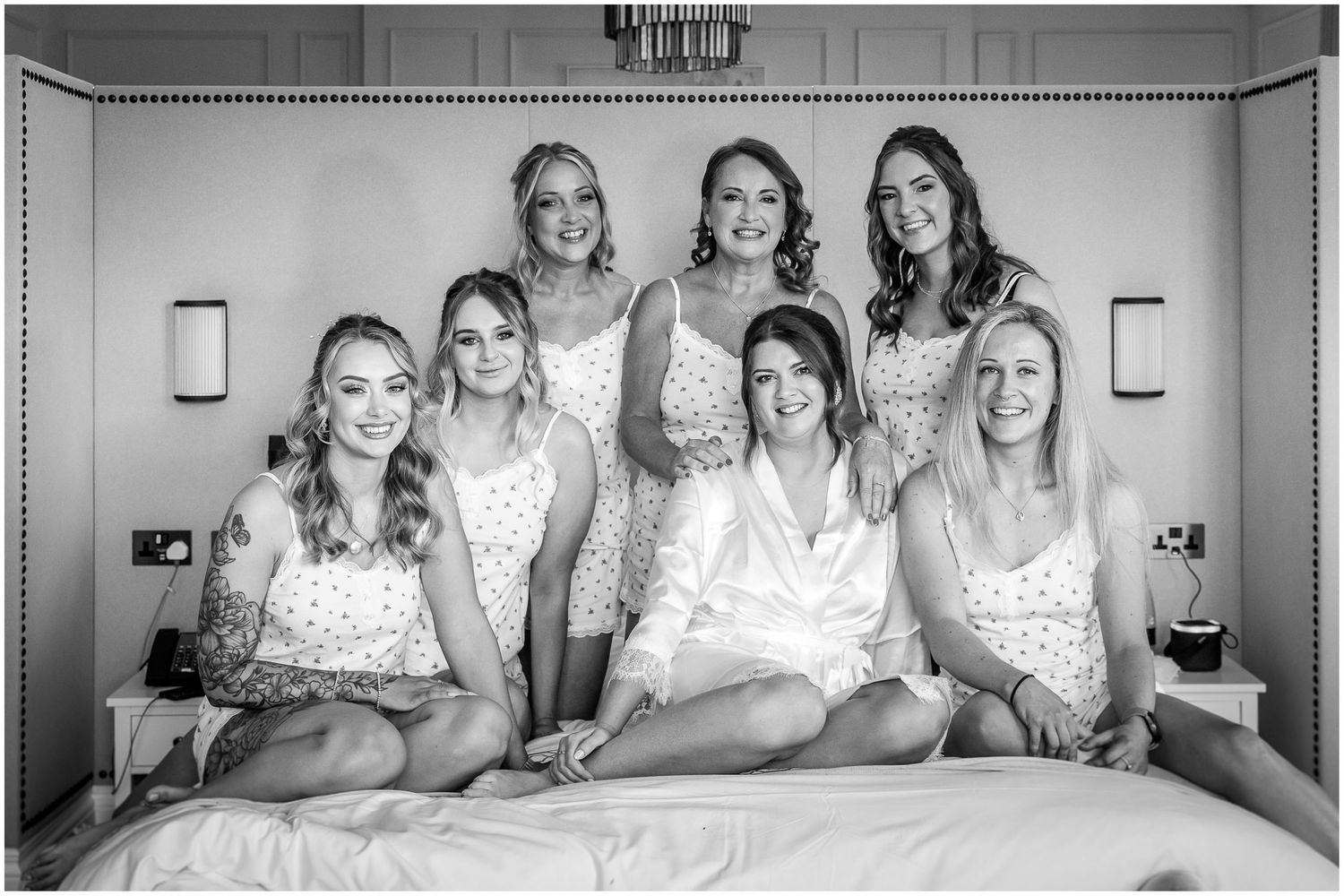 A black and white photo series shows people sitting together on beds in similar poses and compositions.