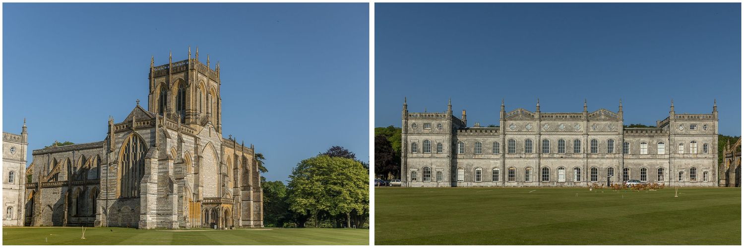 Historic abbey ruins and grand manor house set against bright blue sky on sprawling grounds.