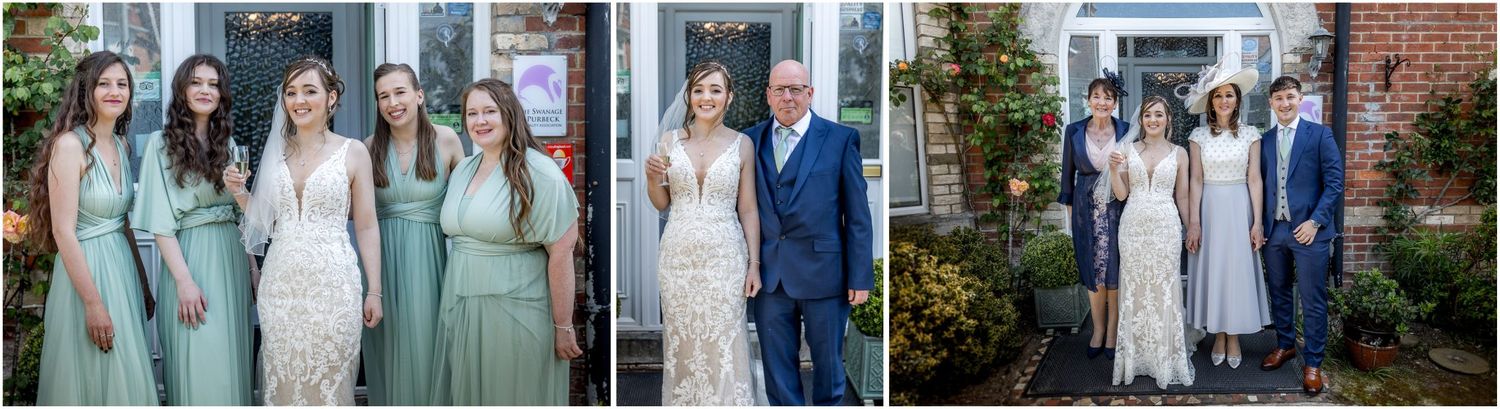 Wedding party gathered outside a brick building in mint green and white attire.