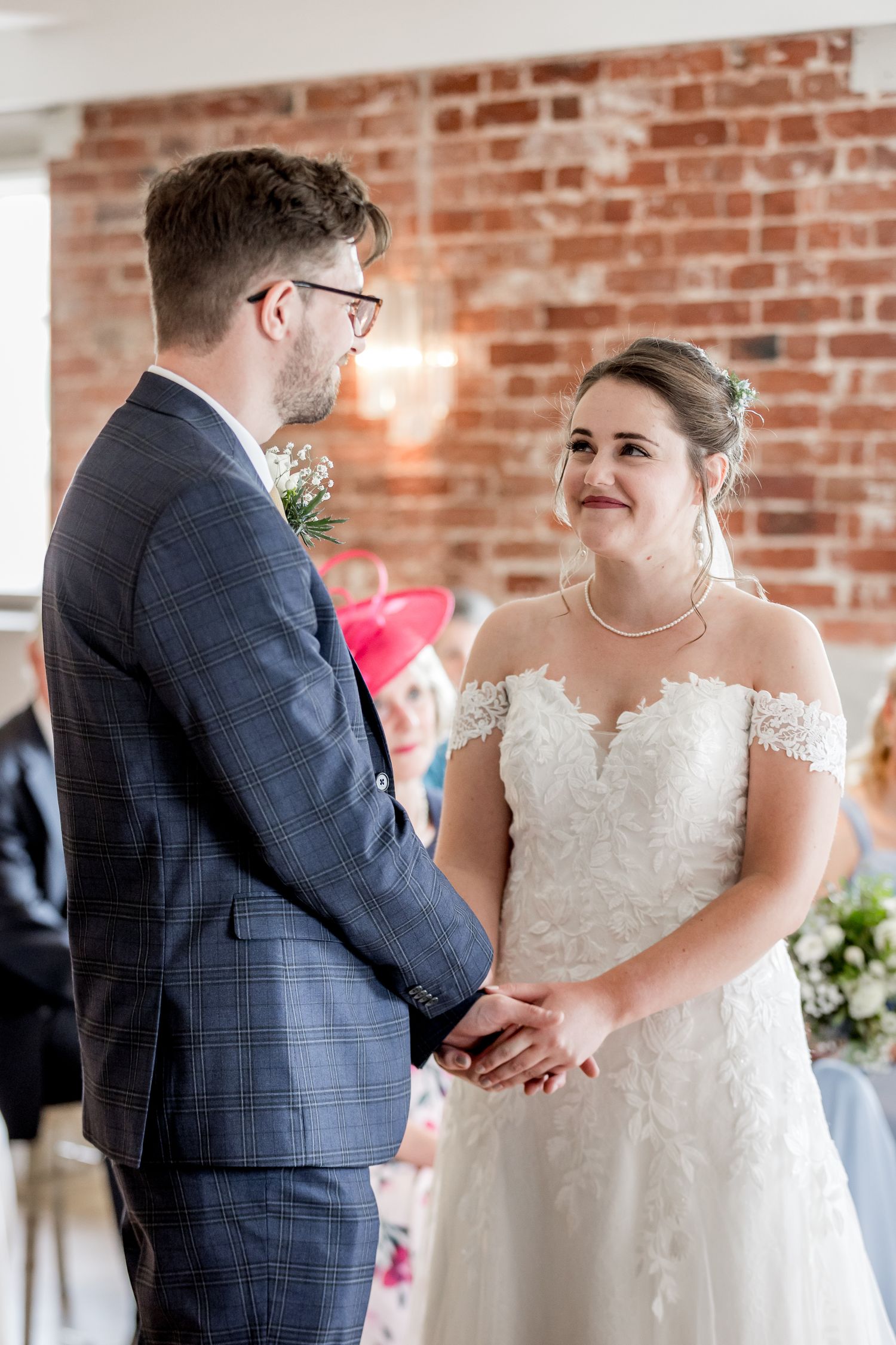 Wedding ceremony moments captured in sequence against a rustic brick wall backdrop.