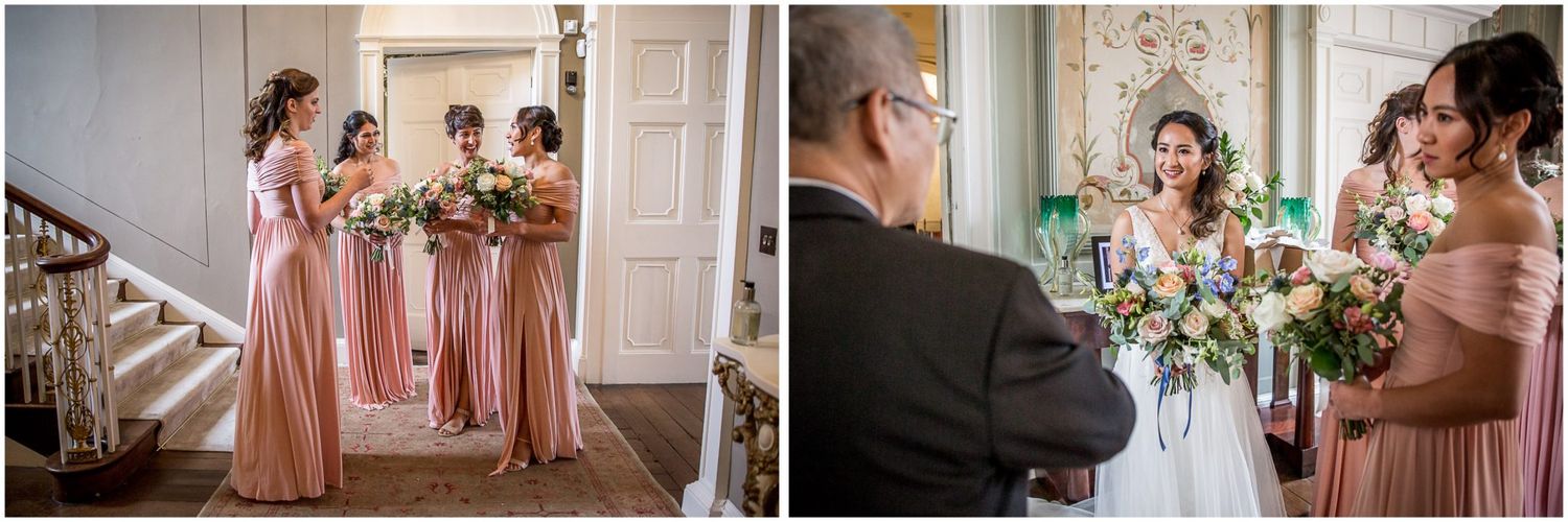 Wedding party celebrates in elegant indoor venue decorated with floral arrangements.