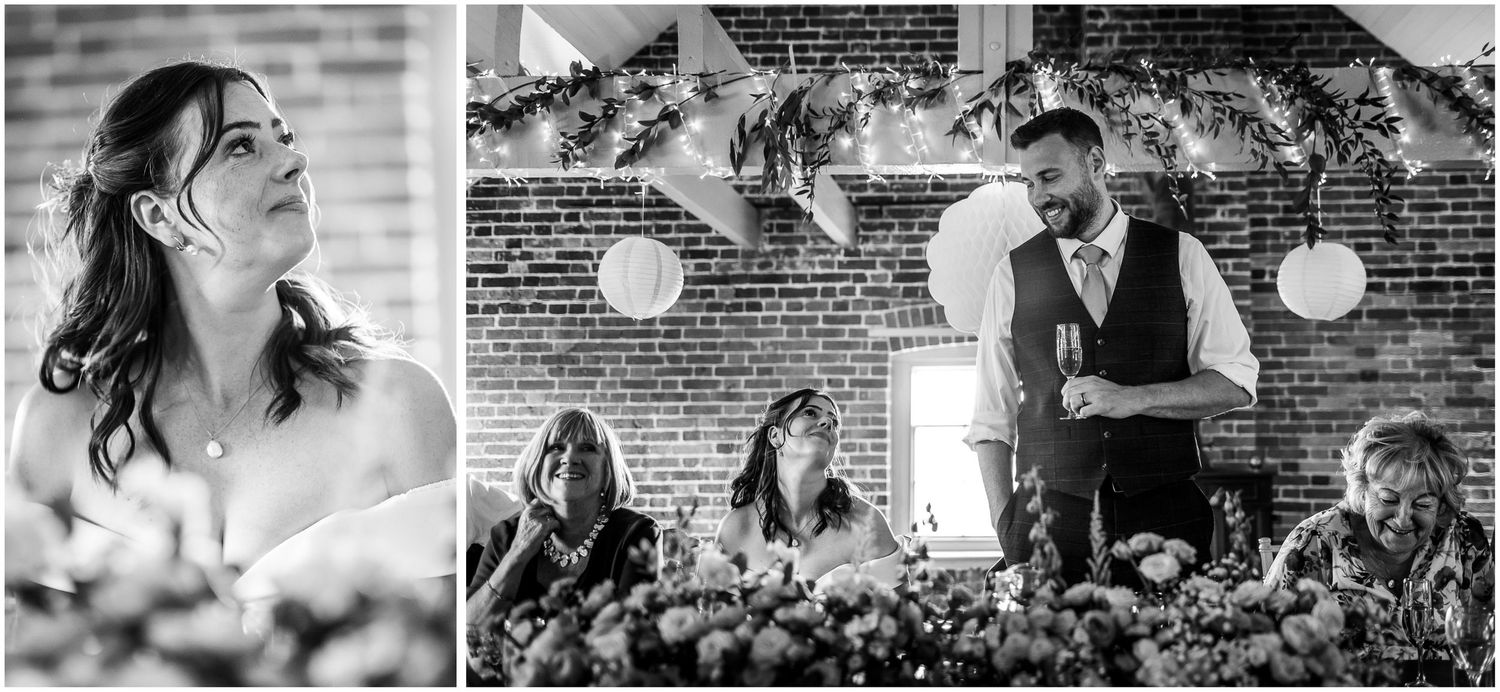 Black and white wedding photo of bride listening as the groom makes a short speech