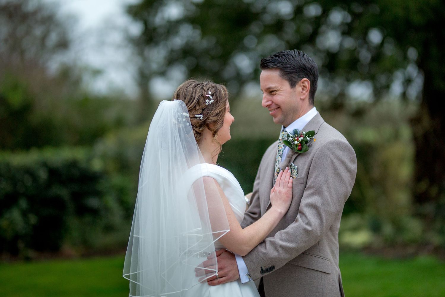 A wedding couple portrait in the gardens of Clock Barn near Whitchurch