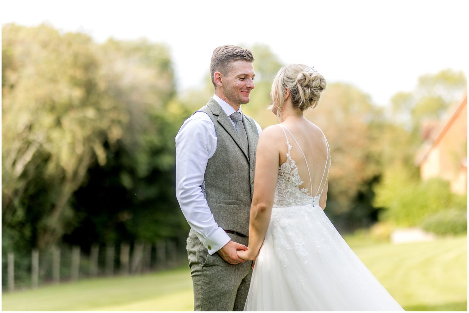 Elegant couple shares intimate moments in an outdoor wedding photoshoot.