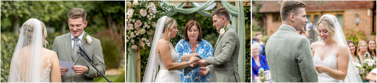Wedding guests seated outdoors in a garden setting with lush greenery in the background.