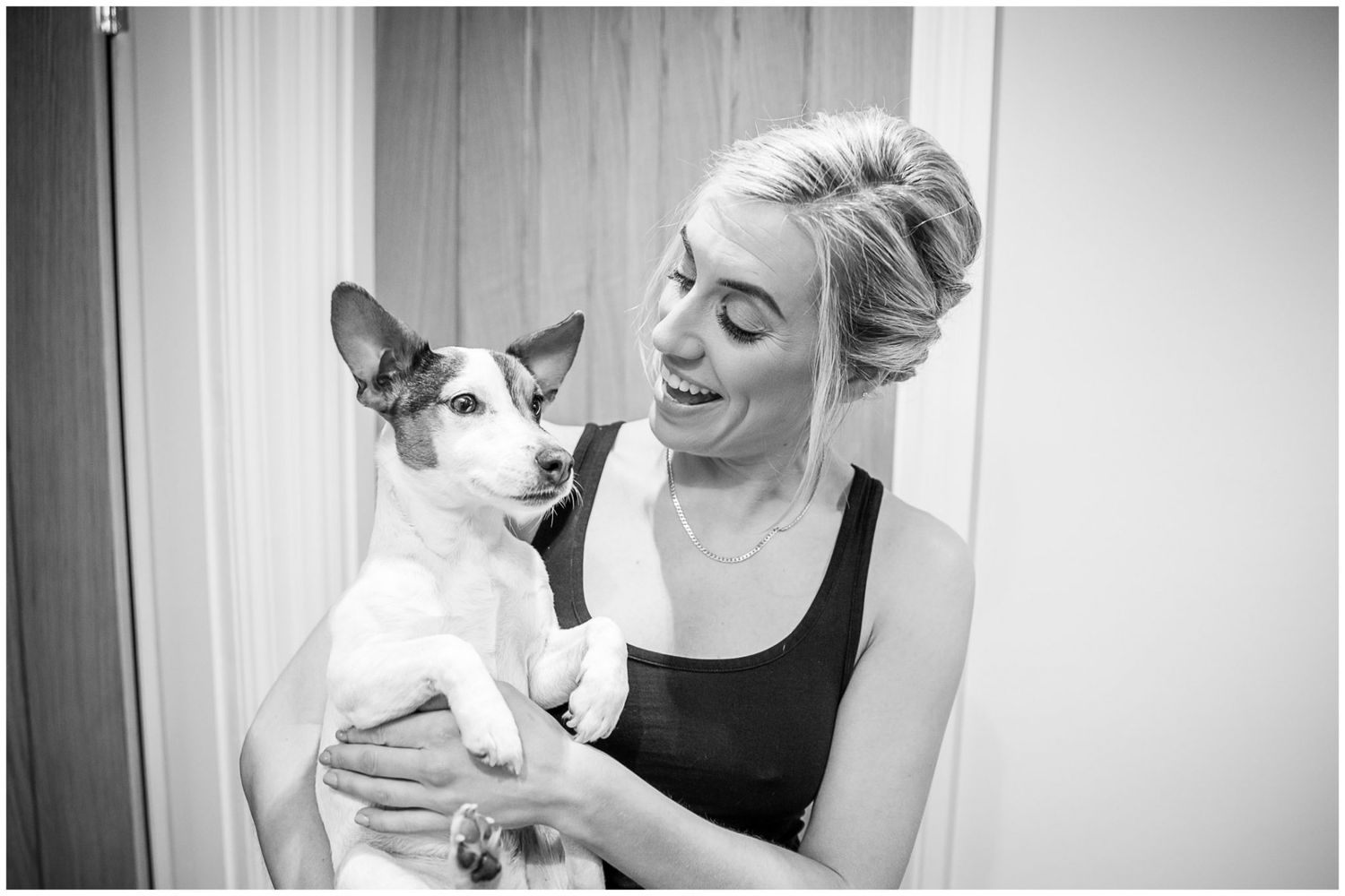 Black and white images showing emotional embraces and tender moments during wedding preparations.