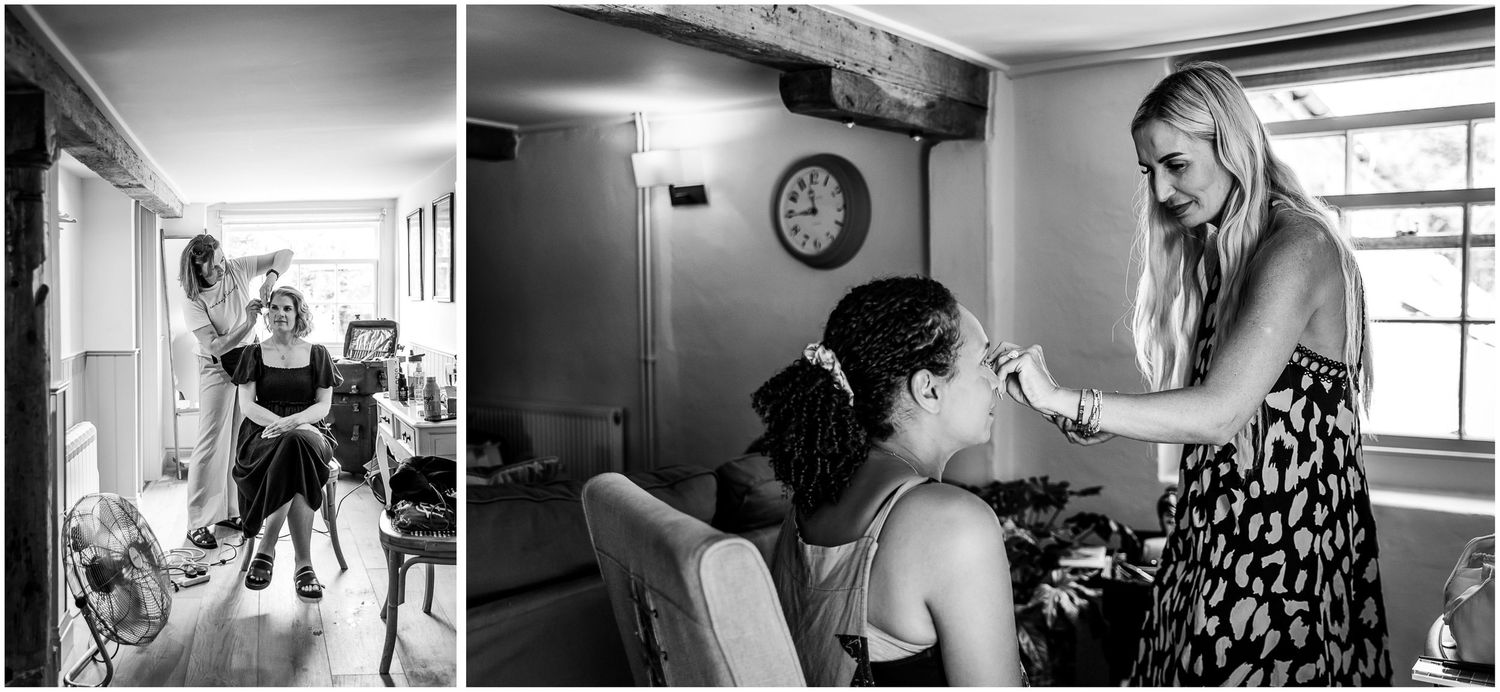 Black and white wedding preparation photo of bridesmaids getting hair styled by a professional hairdresser in Dorset
