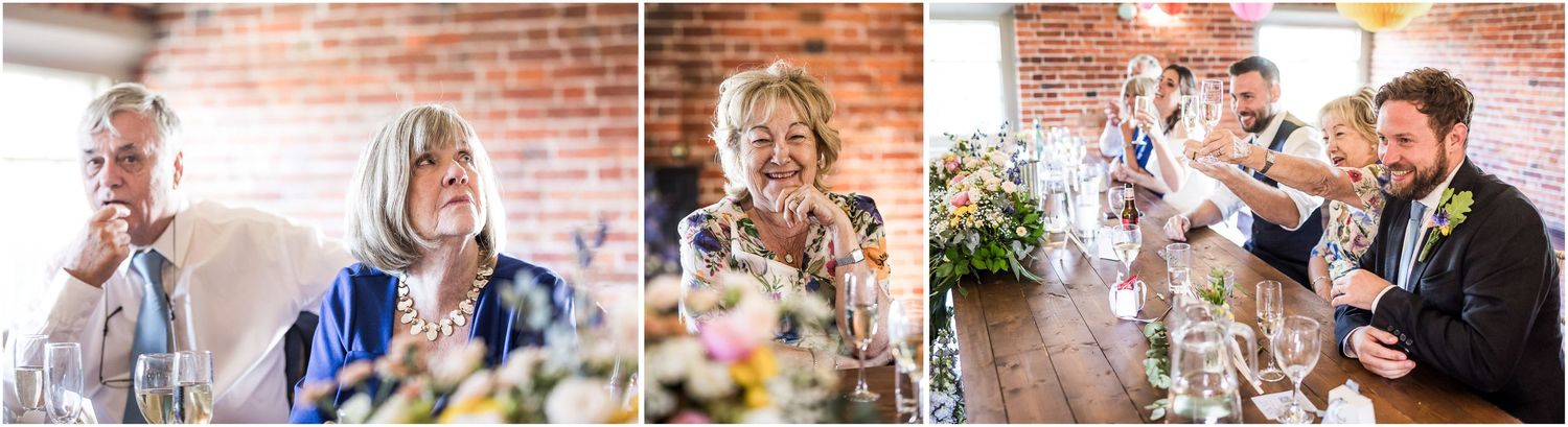 Candid wedding guest photographs during the speeches