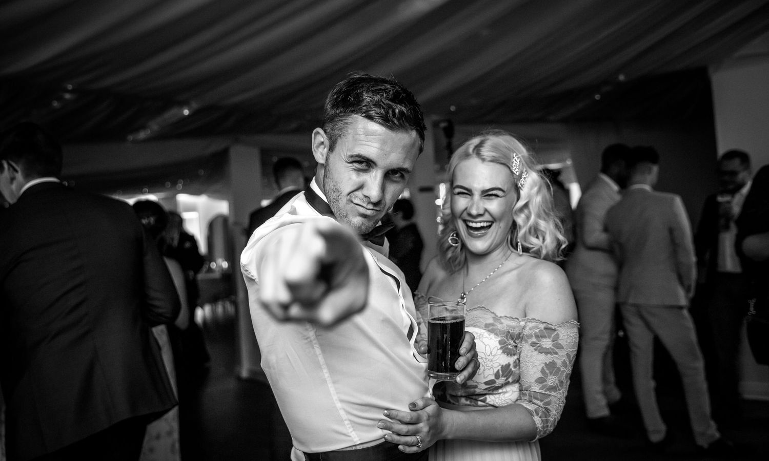 Black and white photograph if wedding guests on the dancefloor at Southdowns Manor