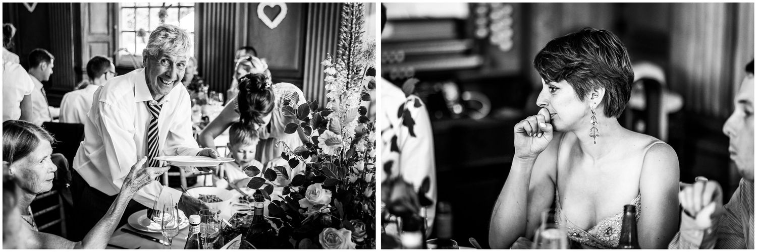 Black and white wedding reception photo showing guests mingling during a reception at Walhampton School in the New Forest