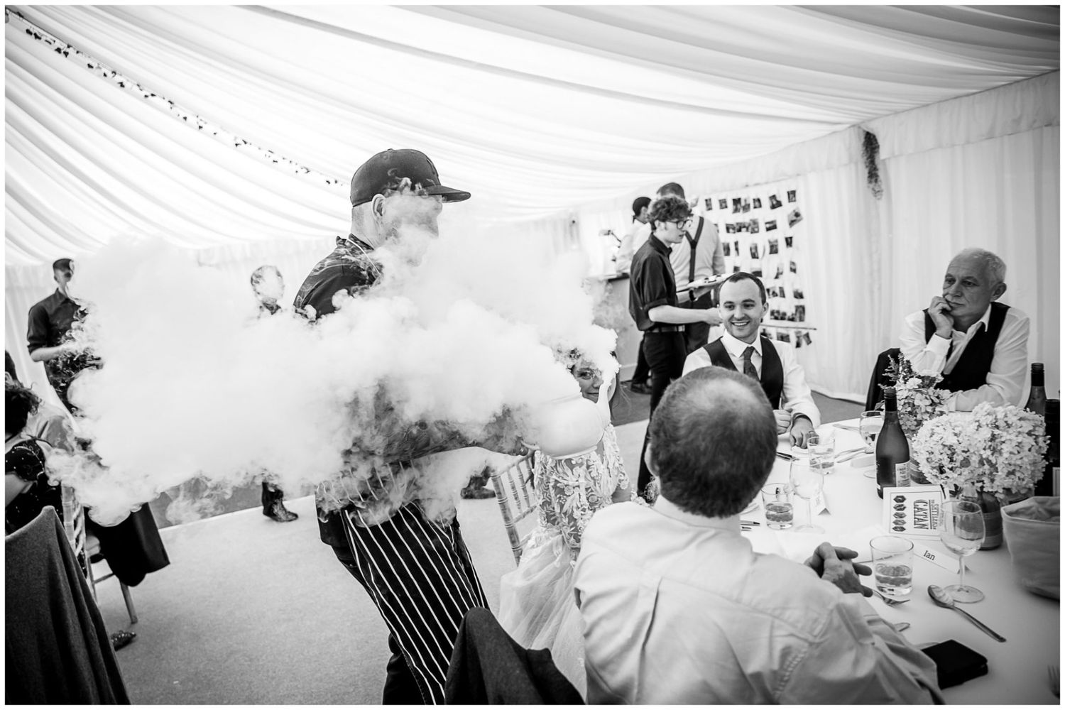Black and white photo montage showing candid moments at a wedding reception with guests dancing and celebrating.